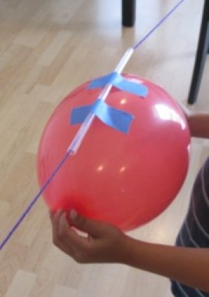 balloon attached to a straw